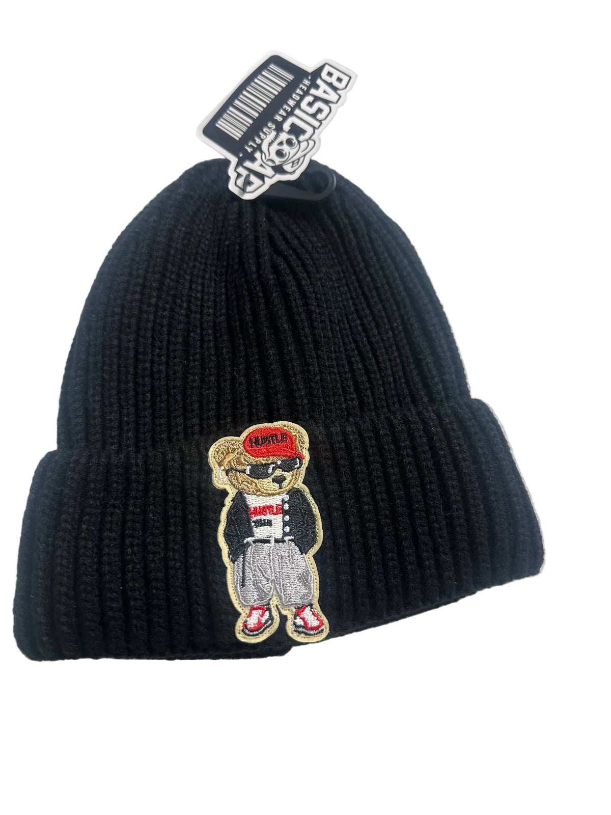 B-Is-TheBrand black ribbed knit beanie featuring a custom embroidered Hustle Bear patch with a red cap and sneakers