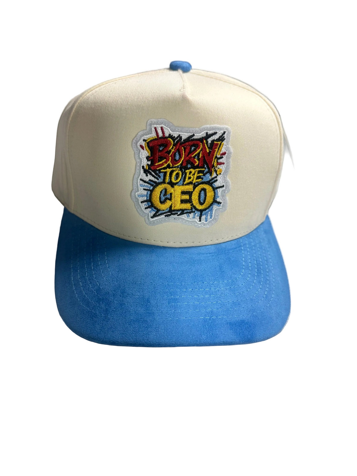 B-Is-TheBrand Born To Be CEO trucker hat with cream foam front, blue suede brim, and vibrant graffiti patch.